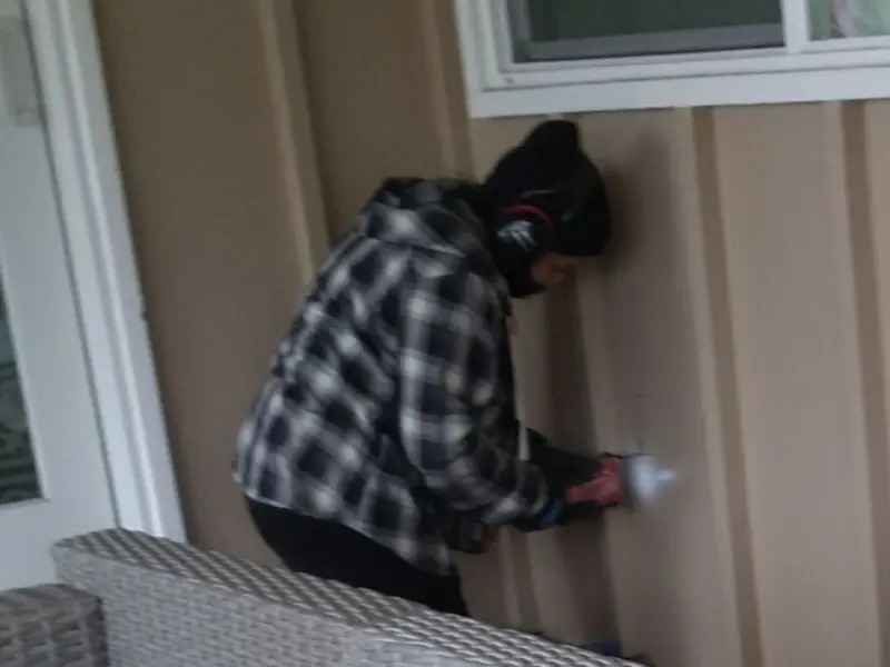 Professional electrician installing an exterior outlet in Braselton